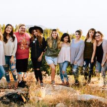 group of women standing on rock fragmen group of women standing on rock fragmen